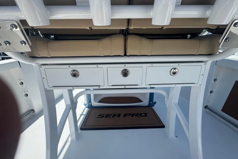 Slide: The Image of Interior view of 2026 Sea Pro 242 Center Console with storage compartments. - 11