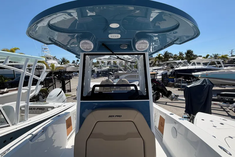 Slide: The Image of 2026 Sea Pro 242 Center Console boat at the marina. - 13