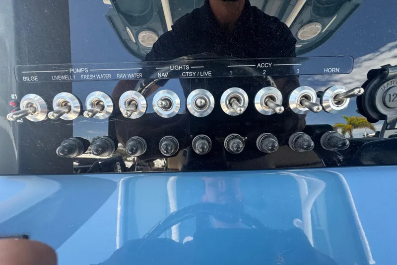 Slide: The Image of Control panel of Sea Pro 242 Center Console boat, year 2026. - 19