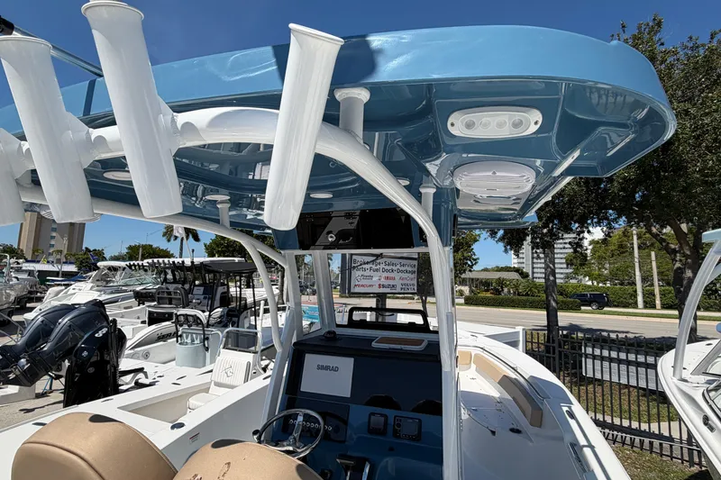 Slide: The Image of 2026 Sea Pro 242 Center Console boat with blue canopy. - 2