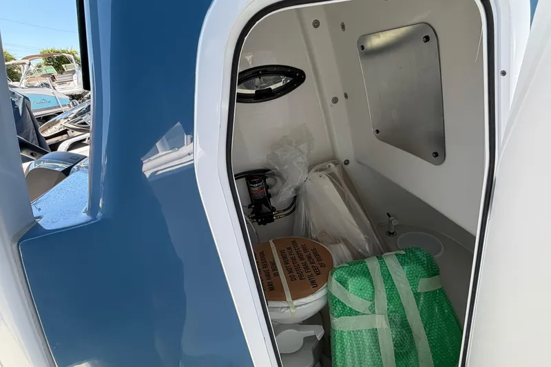 Slide: The Image of Interior of 2026 Sea Pro 242 Center Console with storage space. - 20