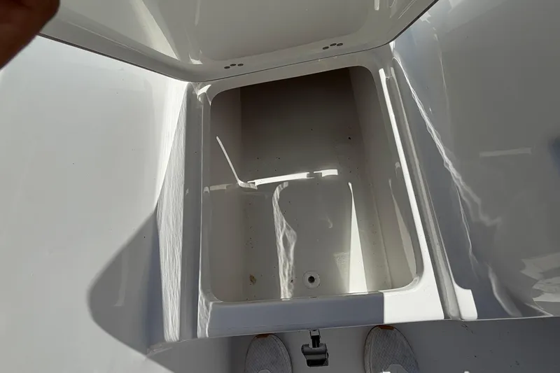 Slide: The Image of Interior view of 2026 Sea Pro 242 Center Console storage compartment. - 26