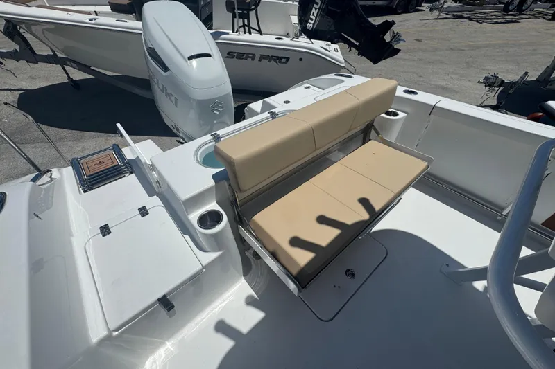 Slide: The Image of 2026 Sea Pro 242 Center Console with beige seating area. - 28