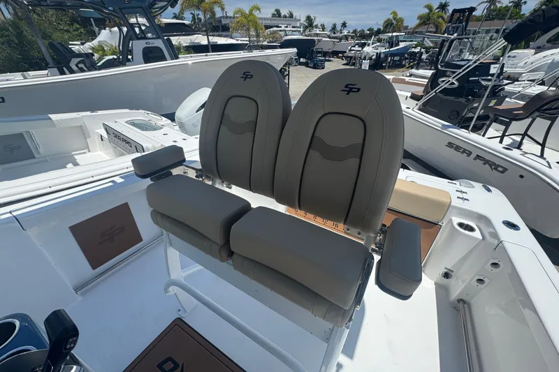 Slide: The Image of 2026 Sea Pro 242 Center Console boat seats at the marina. - 29