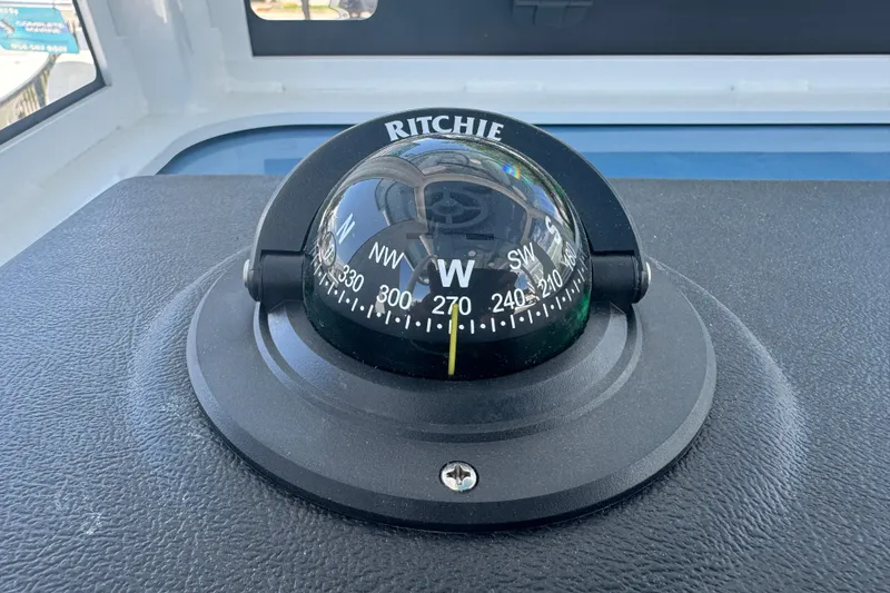 Slide: The Image of Ritchie compass on Sea Pro 242 Center Console 2026. - 32