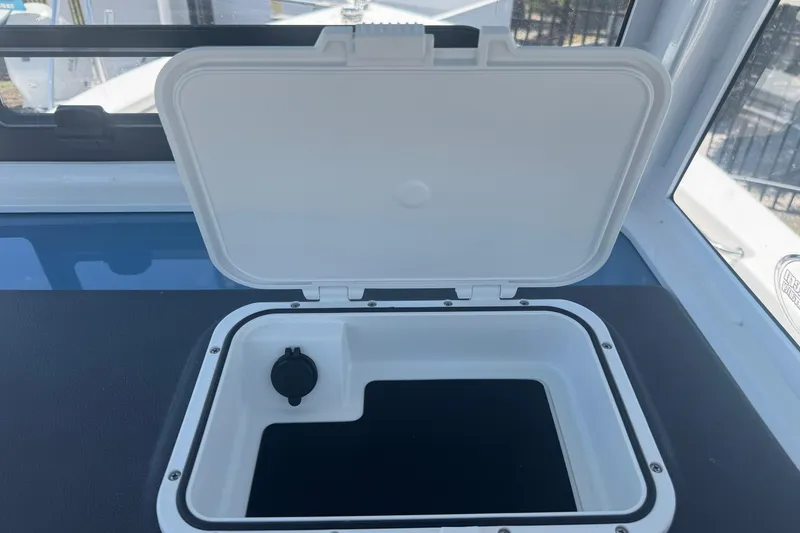 Slide: The Image of Open storage compartment on Sea Pro 242 Center Console 2026. - 34