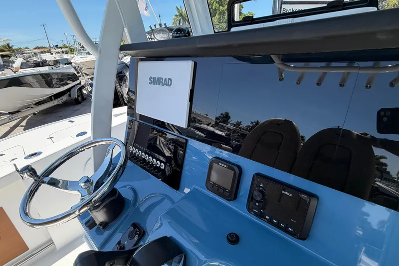 Slide: The Image of Interior view of 2026 Sea Pro 242 Center Console with Simrad controls. - 5