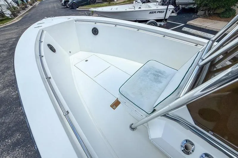 Slide: The Image of 1997 Contender 21 Open boat interior with seating and stainless steel railings. - 10