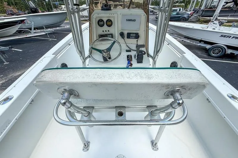 Slide: The Image of 1997 Contender 21 Open boat cockpit with steering wheel and navigation equipment. - 6