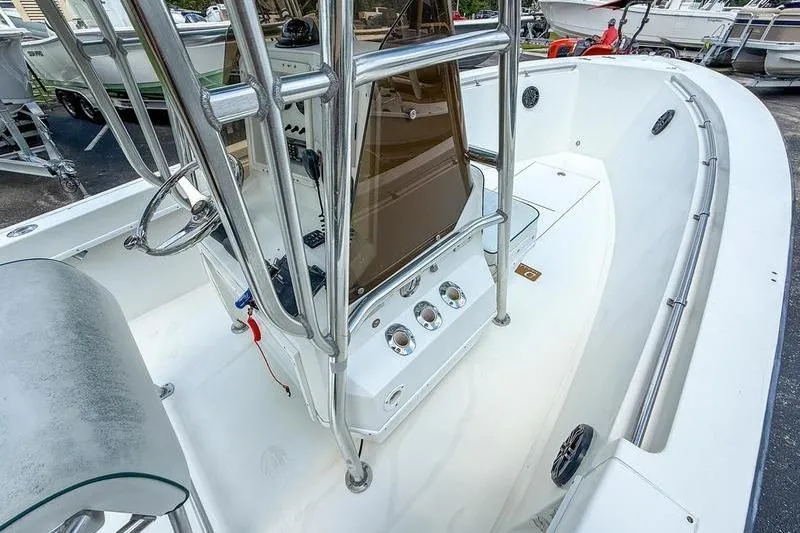 Slide: The Image of 1997 Contender 21 Open boat interior with steering console and seating area. - 7