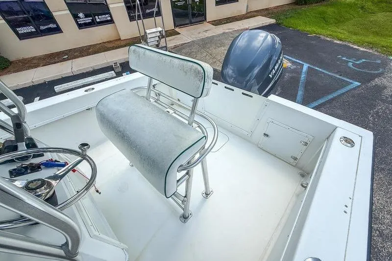 Slide: The Image of 1997 Contender 21 Open boat interior with seating and Yamaha outboard motor. - 8