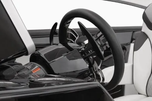 Slide: The Image of Manufacturer Provided Image: 2022 Yamaha Boats 275SD steering wheel and dashboard, featuring sleek black and white design. - 8