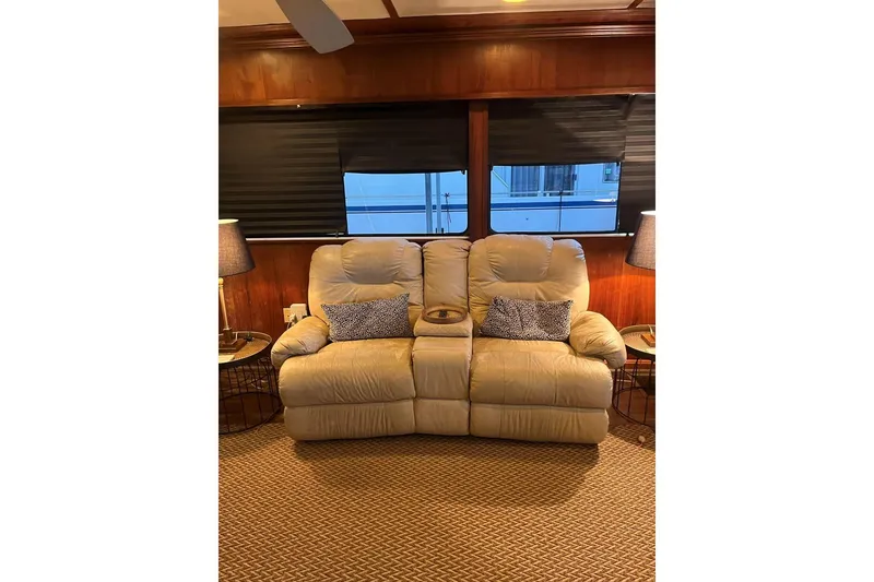 Slide: The Image of Cozy beige recliner sofa in a Sumerset 18x81 houseboat, 1985 model, with stylish decor. - 10