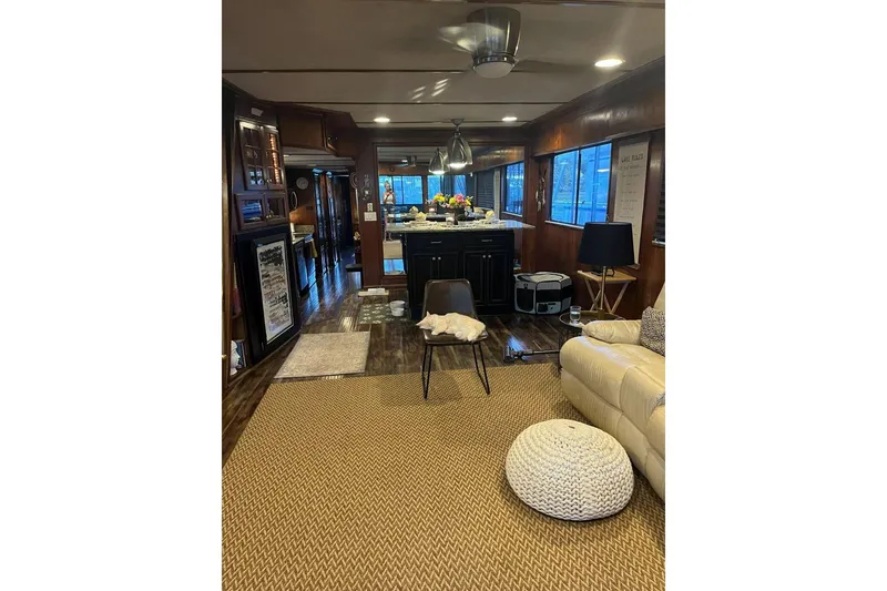 Slide: The Image of Interior of 1985 Sumerset 18x81 houseboat with cozy living area and modern decor. - 15
