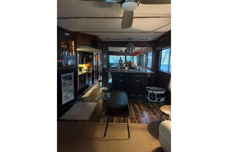 Slide: The Image of Interior of a 1985 Sumerset 18x81 houseboat with modern kitchen and cozy decor. - 16