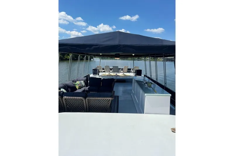 Slide: The Image of Houseboat deck with seating and canopy on a sunny day, Sumerset 18x81, 1985 model. - 27