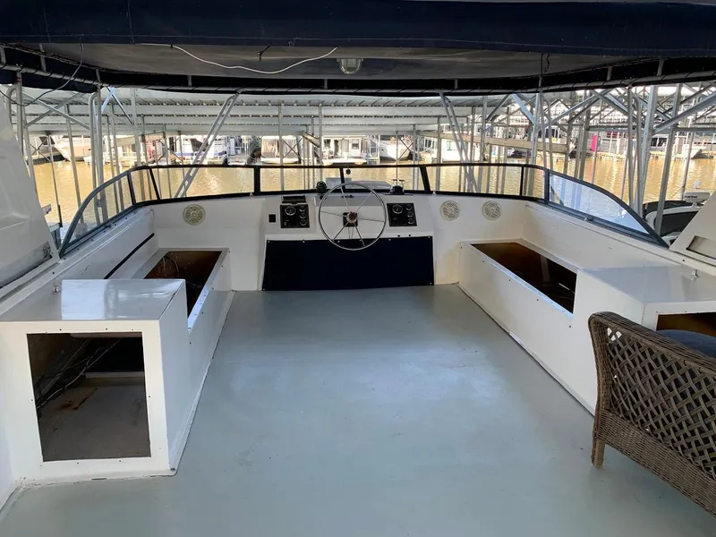 Slide: The Image of Interior view of a 1985 Sumerset 18x81 houseboat with helm station. - 28