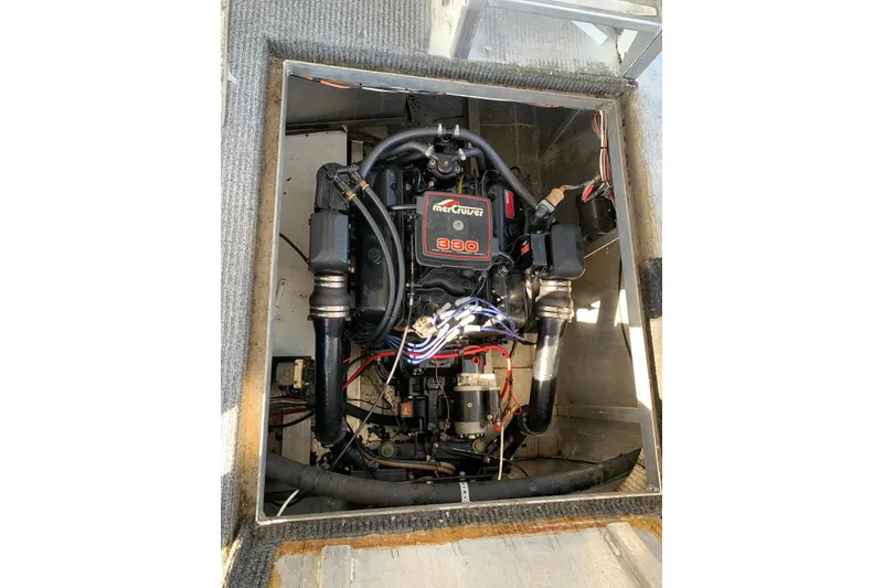 Slide: The Image of Engine compartment of a 1985 Sumerset 18x81 houseboat with MerCruiser 330 engine. - 33