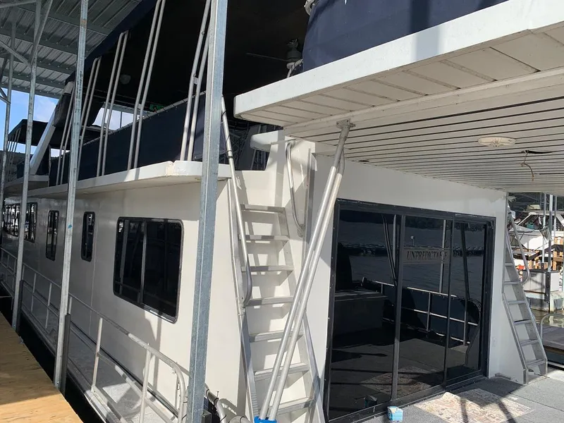 Slide: The Image of 1985 Sumerset 18x81 houseboat docked at marina. - 5