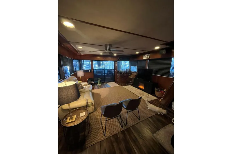 Slide: The Image of Cozy interior of a 1985 Sumerset 18x81 houseboat with modern furnishings. - 8