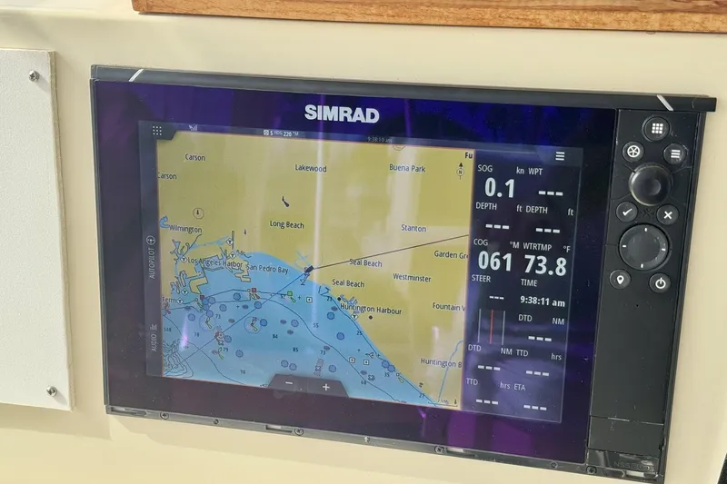 Slide: The Image of Simrad navigation display on 1988 Viking 48 Convertible boat, showing nautical map and data. - 16
