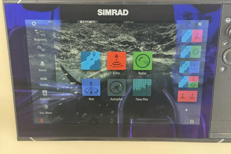 Slide: The Image of Simrad marine navigation display on 1988 Viking 48 Convertible boat, showing various control options. - 17