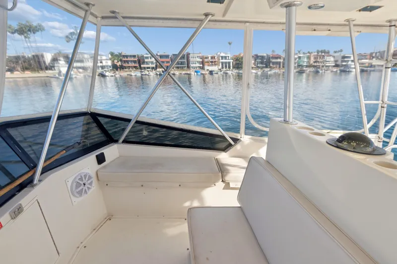 Slide: The Image of 1988 Viking 48 Convertible yacht interior with waterfront view and seating area. - 20