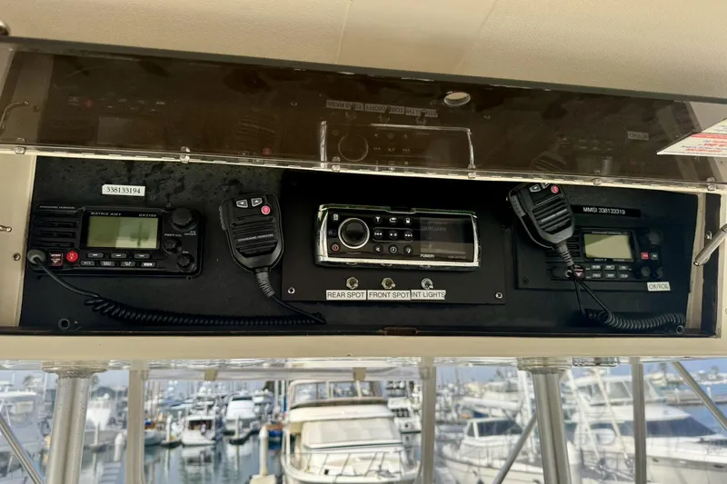 Slide: The Image of Control panel of a 1988 Viking 48 Convertible yacht with communication equipment. - 22