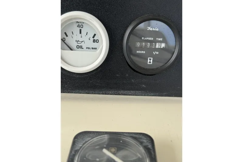 Slide: The Image of Oil pressure and elapsed time gauges on a 1988 Viking 48 Convertible boat. - 24