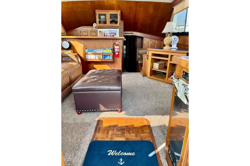 Slide: The Image of Interior of 1988 Viking 48 Convertible yacht with cozy seating and nautical decor. - 26