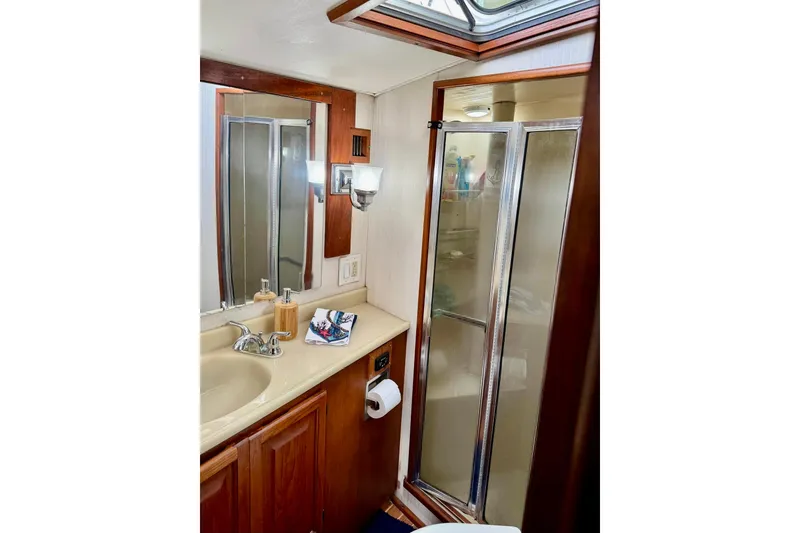 Slide: The Image of Bathroom interior of 1988 Viking 48 Convertible yacht with shower and sink. - 35