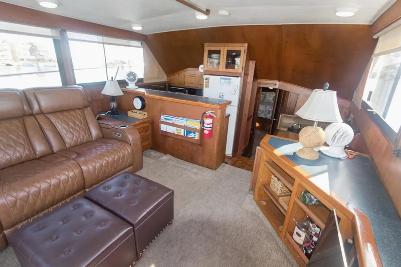 Slide: The Image of Luxurious interior of 1988 Viking 48 Convertible yacht with leather seating and wooden cabinetry. - 41