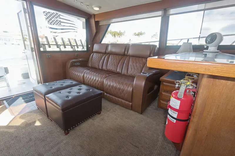 Slide: The Image of Interior of 1988 Viking 48 Convertible yacht with leather seating and American flag decor. - 46