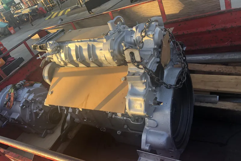 Slide: The Image of Engine of a 1988 Viking 48 Convertible boat on a trailer. - 49