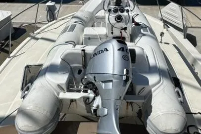 Slide: The Image of 1988 Viking 48 Convertible yacht with inflatable boat and Honda outboard motor. - 51