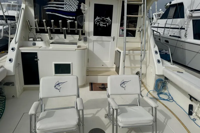 Slide: The Image of 1988 Viking 48 Convertible yacht deck with fishing chairs and equipment. - 6