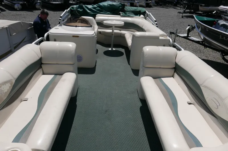Slide: The Image of 2005 Bennington 257FS pontoon boat interior with spacious seating and table. - 4
