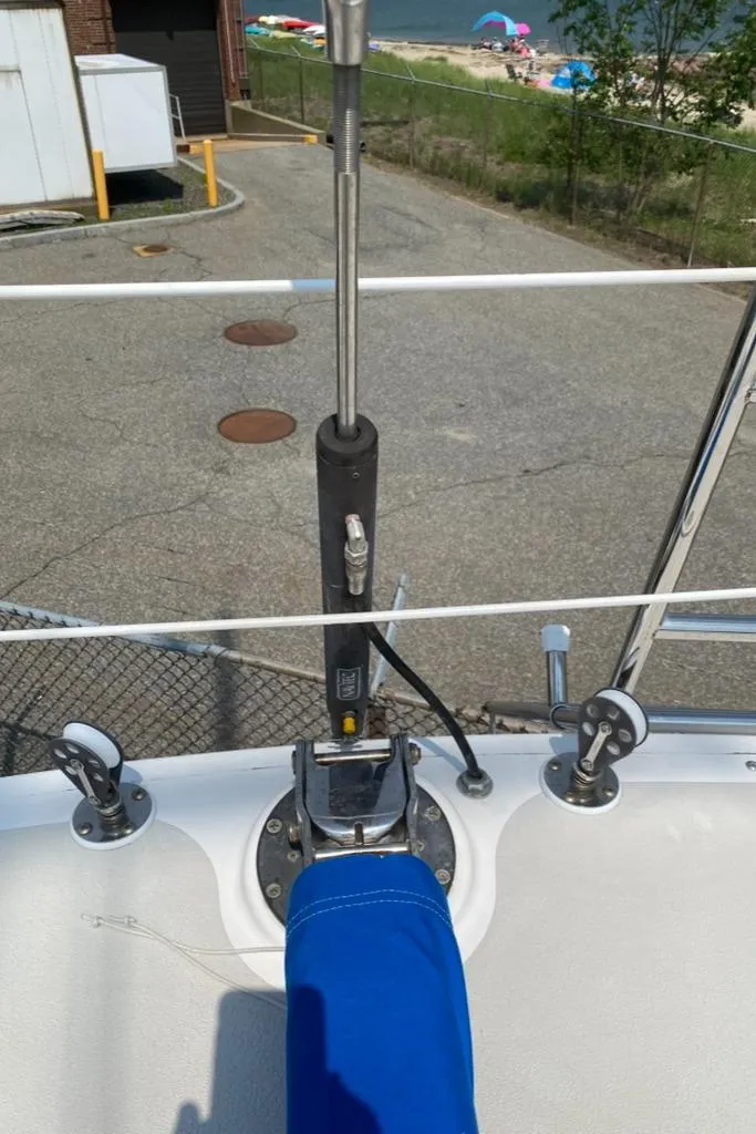 Slide: The Image of Sailboat deck of 1986 Express 37 with rigging and blue cover. - 19