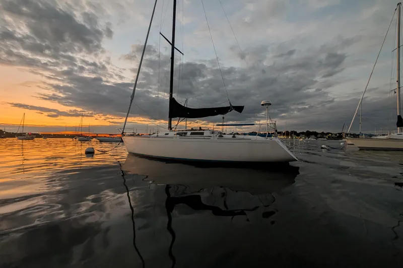 Slide: The Image of Sailboat on calm water at sunset, Express 37, 1986 model. - 3