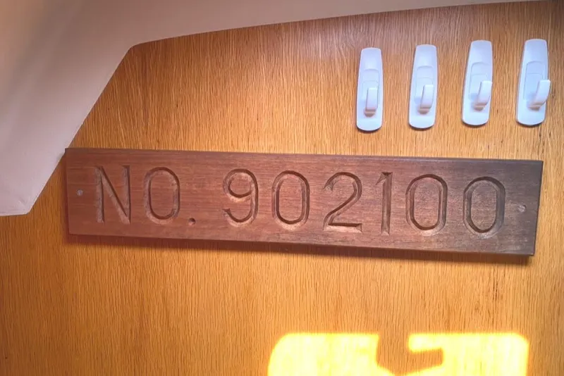 Slide: The Image of Wooden plaque with "NO. 902100" on Express 37, 1986 model interior. - 39
