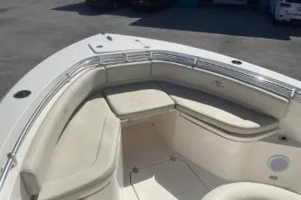 Slide: The Image of 2022 Cobia 237 Center Console boat with spacious seating and sleek design. - 10