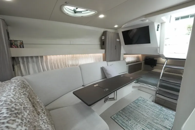Slide: The Image of Luxurious interior of 2021 Regal 33 XO yacht with modern seating and entertainment area. - 11