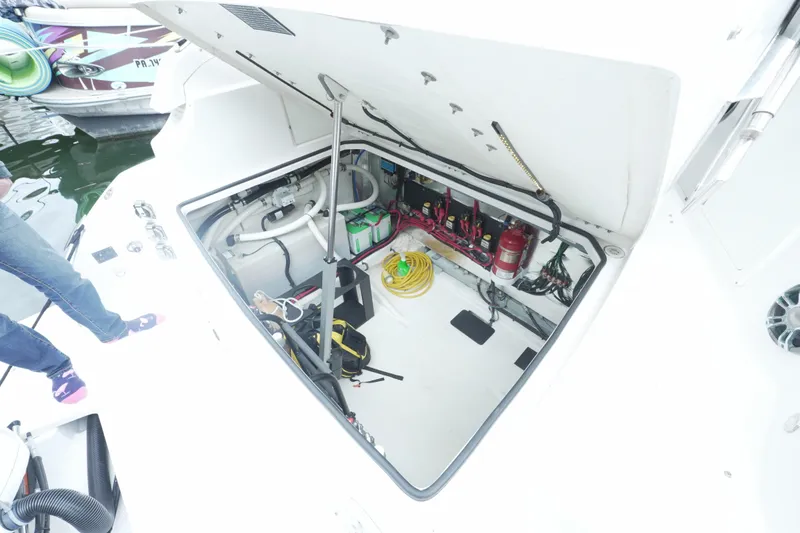 Slide: The Image of Open engine compartment of 2021 Regal 33 XO boat, showing equipment and wiring. - 20