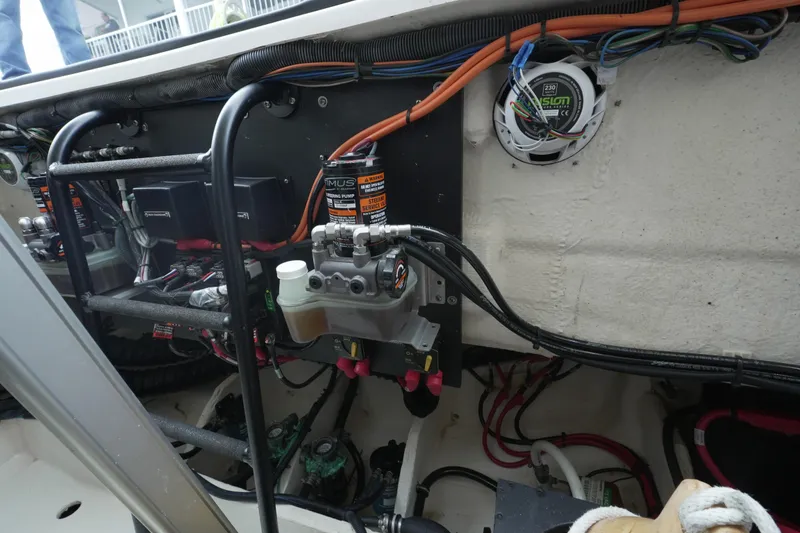 Slide: The Image of Engine compartment of a 2021 Regal 33 XO boat, showcasing wiring and components. - 22