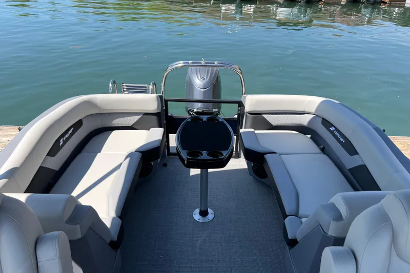 Slide: The Image of Luxurious 2026 Starcraft VX 22 R DH pontoon boat interior with plush seating. - 13