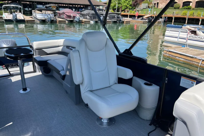 Slide: The Image of Luxurious interior of 2026 Starcraft VX 22 R DH pontoon boat at marina. - 8