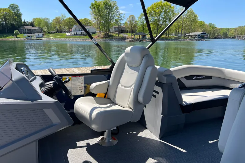 Slide: The Image of Interior of 2026 Starcraft VX 22 R DH boat with lake view. - 9