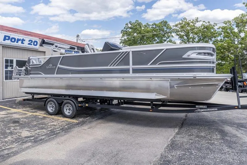 The Image of 2026 SunCatcher Elite 326 SL pontoon boat on trailer, parked at Port 20 dealership. - 1
