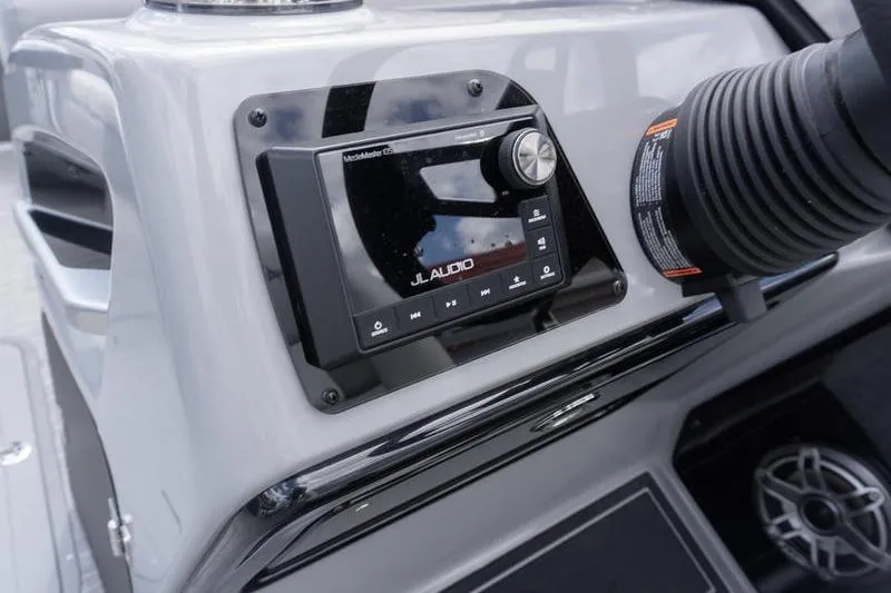 Slide: The Image of JL Audio system on 2026 SunCatcher Elite 326 SL boat dashboard. - 10