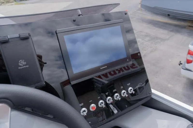 Slide: The Image of Dashboard of 2026 SunCatcher Elite 326 SL with Garmin display and controls. - 11